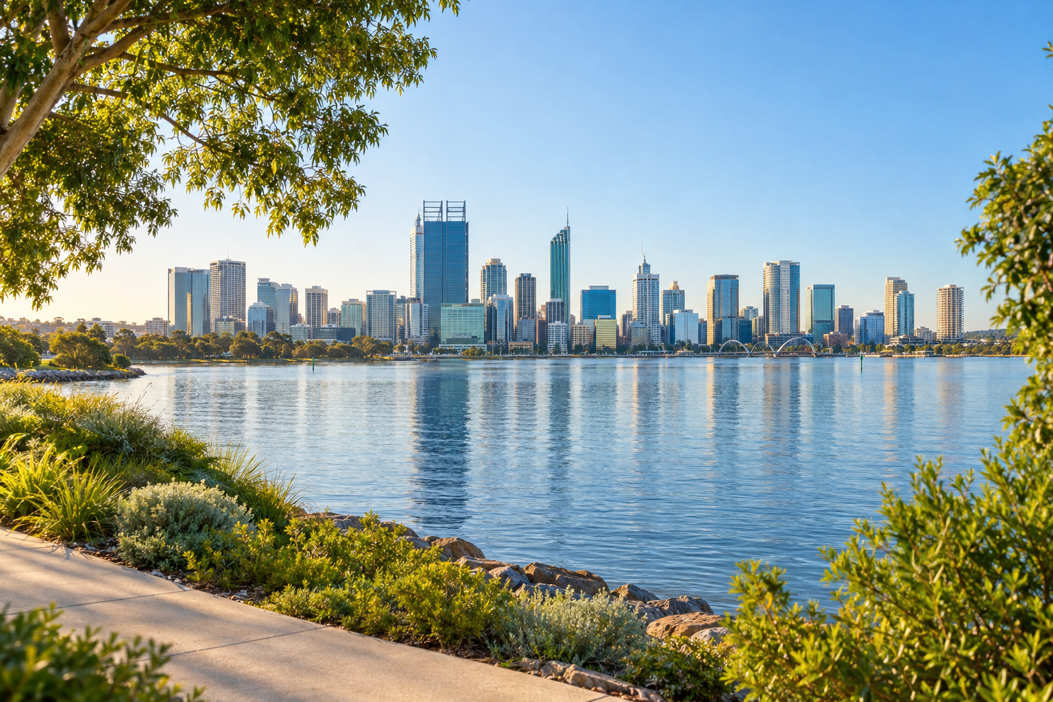 Representative Perth skyline and Swan River waterfront framed by green trees